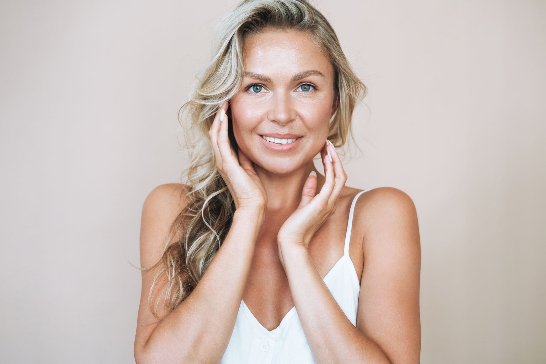 Woman in a bathrobe, relaxing and thoughtful.