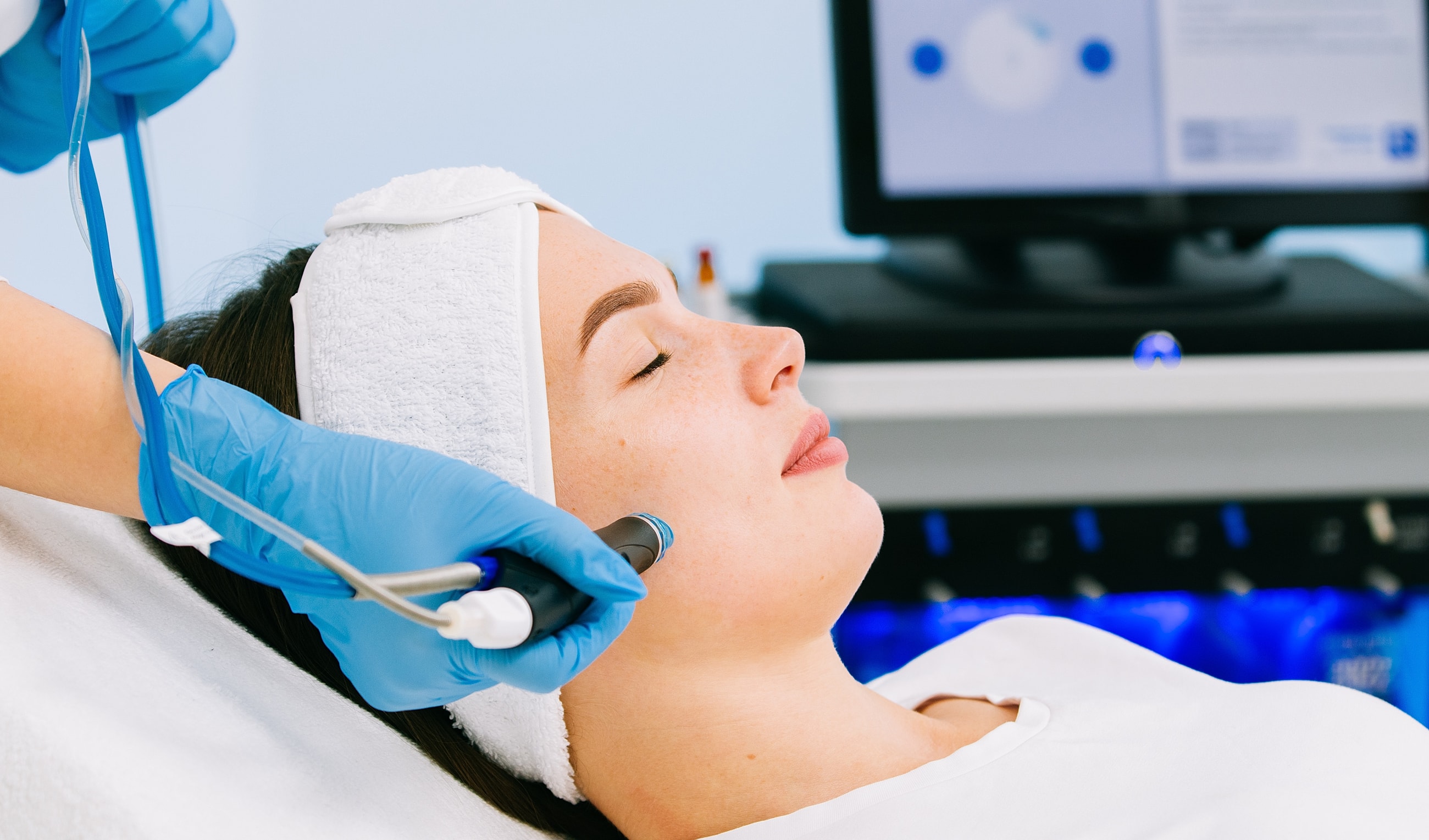 Woman receiving skin treatment in a spa.