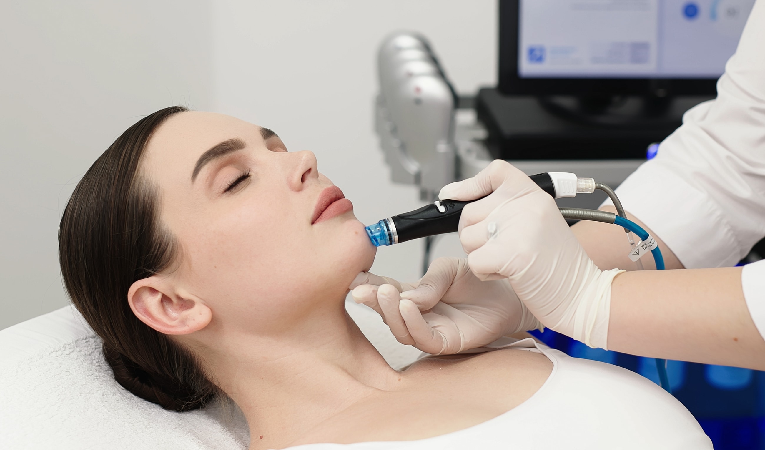 Facial treatment being performed on a woman.