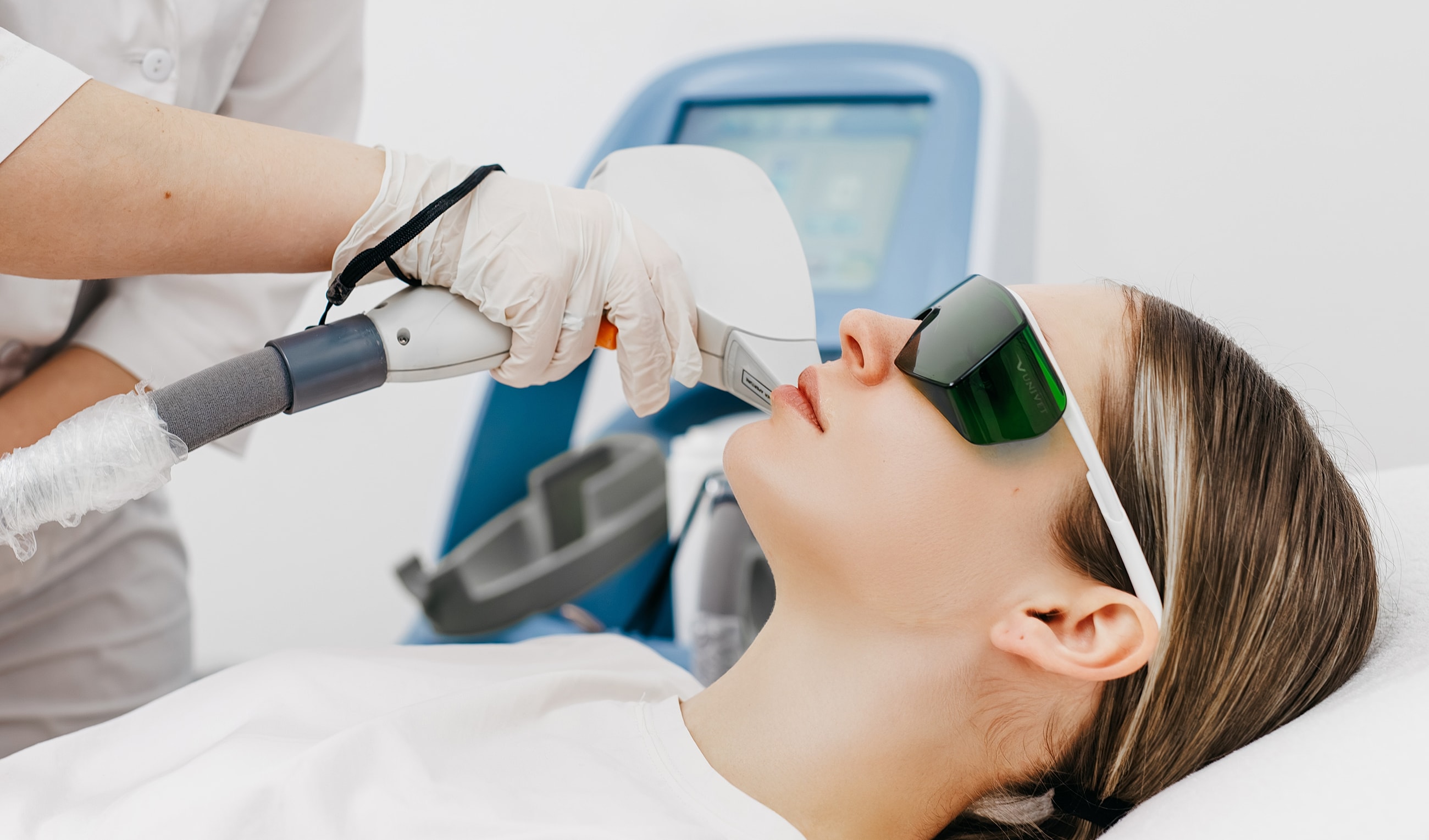 Woman receiving a laser treatment at clinic