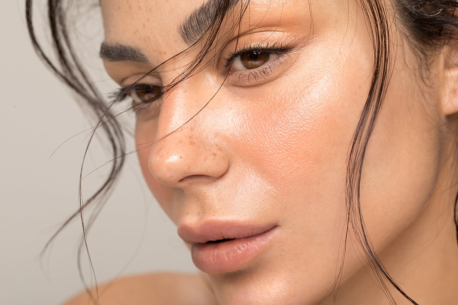 Close-up of a woman's face with natural makeup.