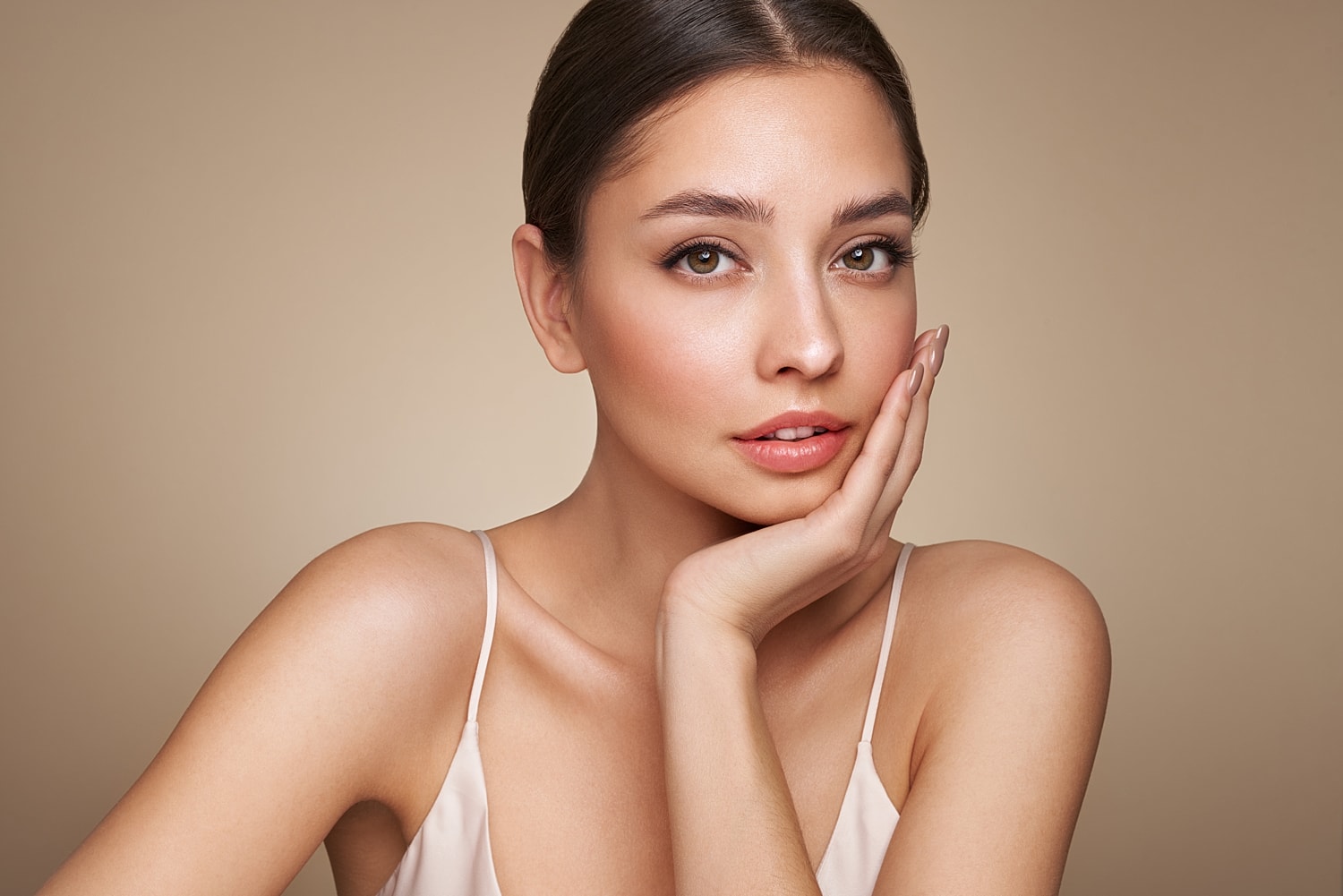 Woman with natural makeup and soft lighting.